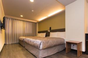 Postel nebo postele na pokoji v ubytování Chance Hotel
