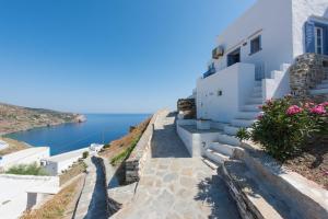 a house on the cliff with a view of the ocean at Aris & Maria Houses in Kastron