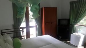 Postel nebo postele na pokoji v ubytování KANDY Holiday Residence