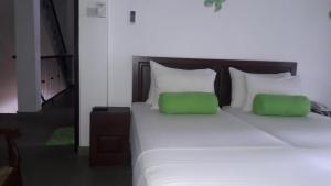 Postel nebo postele na pokoji v ubytování KANDY Holiday Residence