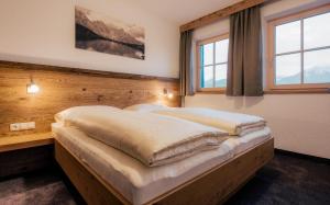 Posteľ alebo postele v izbe v ubytovaní Appartements Alexander