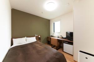 Krevet ili kreveti u jedinici u okviru objekta Hotel Sun Clover Koshigaya Eki mae