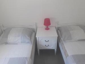 Postel nebo postele na pokoji v ubytování Apartments Villa Plava
