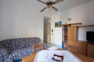 a living room with a couch and a table at Casa Beverini in La Spezia