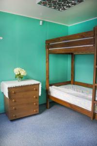 a bedroom with a bunk bed and a dresser at Dacha v Odesse in Odesa