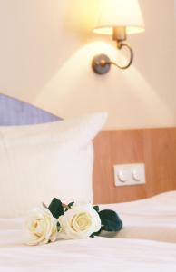 Postel nebo postele na pokoji v ubytování Hotel Gasthof Krone