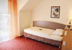 Postel nebo postele na pokoji v ubytování Hotel Gasthof Krone