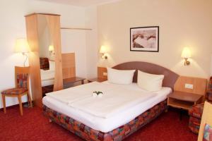 Postel nebo postele na pokoji v ubytování Hotel Gasthof Krone