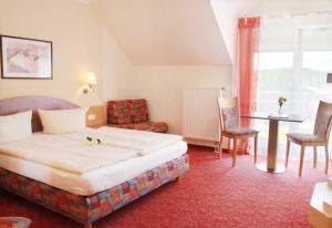 Postel nebo postele na pokoji v ubytování Hotel Gasthof Krone