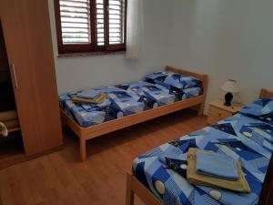 Postel nebo postele na pokoji v ubytování Apartment Ruzmarin