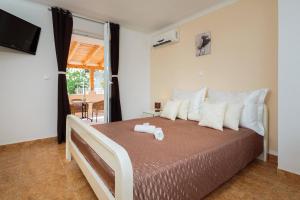 Postel nebo postele na pokoji v ubytování Apartment Krželj