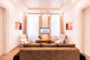 Televízia a/alebo spoločenská miestnosť v ubytovaní BpR D8 Premier Apartment