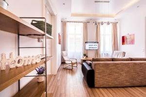 Televízia a/alebo spoločenská miestnosť v ubytovaní BpR D8 Premier Apartment