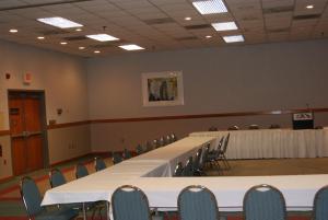 a conference room with white tables and chairs at Motel 6 Hastings NE in Hastings +18 photos