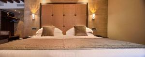 Postel nebo postele na pokoji v ubytování Rosa Salva Hotel