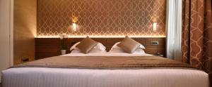 Postel nebo postele na pokoji v ubytování Rosa Salva Hotel