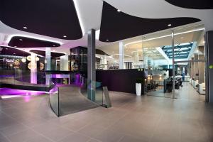 a lobby of a shopping center with purple lighting at Flash Hotel Benidorm - Recommended Adults Only 4 Sup in Benidorm