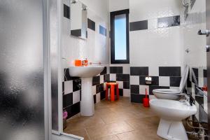 a bathroom with a toilet and a sink at Su AlevraXi in Villagrande Strisaili +14 photos
