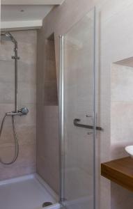 a shower with a glass door in a bathroom at Dubrovnik Sweet House in Dubrovnik