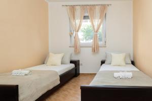 Postel nebo postele na pokoji v ubytování Apartment Krželj