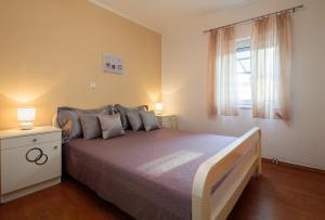 Postel nebo postele na pokoji v ubytování Apartment Krželj