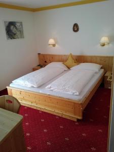 Postel nebo postele na pokoji v ubytování Garni Waltoy