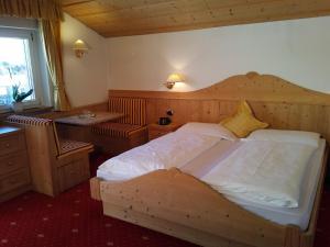 Postel nebo postele na pokoji v ubytování Garni Waltoy