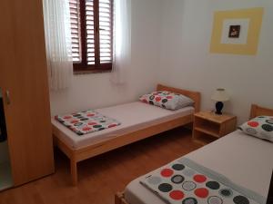 Postel nebo postele na pokoji v ubytování Apartment Ruzmarin