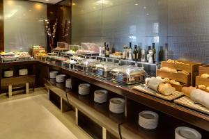 a buffet line with a lot of food on display at Meliá Genova in Genoa