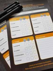 a graphing calculator with a pen on top of it at Le Studio by La Reine City Center in Spa +2 photos