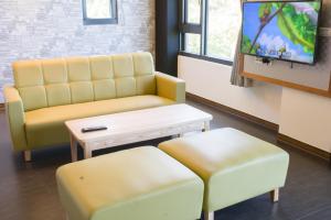 Een TV en/of entertainmentcenter bij Whitecaps B&B
