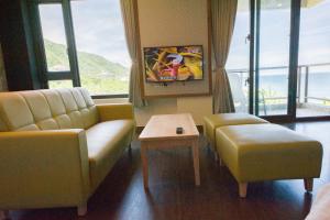 Een TV en/of entertainmentcenter bij Whitecaps B&B
