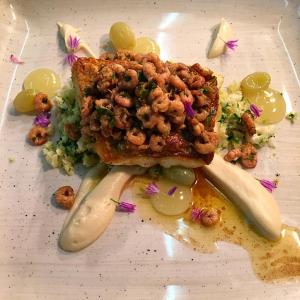 a plate of food with a piece of bread and vegetables at The Bath Arms Hotel in Cheddar
