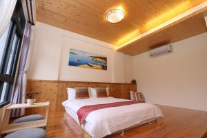 Voodi või voodid majutusasutuse Jiaoxi Song Tian B&B toas