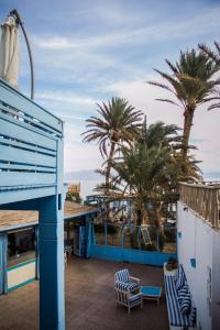 a view from the balcony of a resort with palm trees at El Primo Hotel Dahab in Dahab