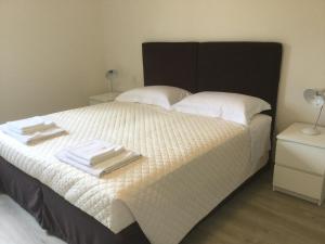 Postel nebo postele na pokoji v ubytování Dimora 16 Rooms & Garden