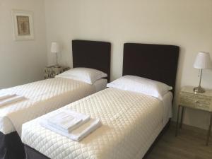Postel nebo postele na pokoji v ubytování Dimora 16 Rooms & Garden