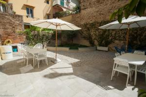 A patio or other outdoor area at Dimora 16 Rooms & Garden