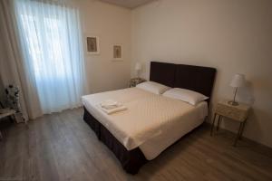 Postel nebo postele na pokoji v ubytování Dimora 16 Rooms & Garden