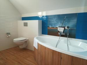Kúpeľňa v ubytovaní Apartamenty Kapitanskie