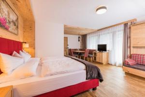 Postel nebo postele na pokoji v ubytování Hotel Augarten