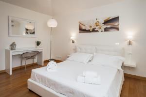 Una cama o camas en una habitación de Fabuloucity Fontana di Trevi