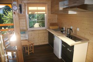 a small kitchen with a sink and a counter top at Ośrodek Wczasowy GEO-SEA in Dźwirzyno