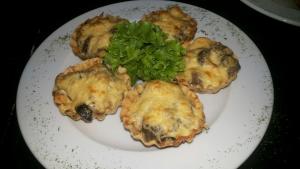 a plate of food with broccoli and mushrooms on it at Recreation Complex Uzhanski Kupeli in Volosyanka +28 photos
