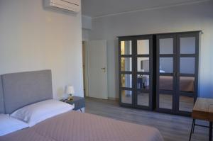 Postel nebo postele na pokoji v ubytování Dimora 16 Rooms & Garden