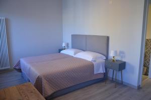 Postel nebo postele na pokoji v ubytování Dimora 16 Rooms & Garden