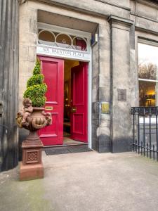 a statue of a bear in front of a building at Six Brunton Place in Edinburgh
