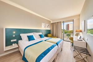 Hotel Sipar Plava Laguna客房内的一张或多张床位