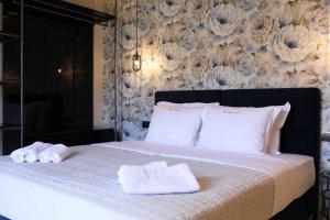 Кровать или кровати в номере 4 Seasons Luxury Apartments