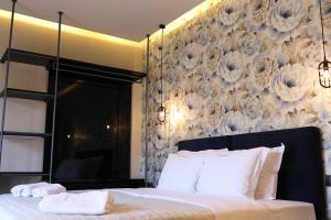 Ένα ή περισσότερα κρεβάτια σε δωμάτιο στο 4 Seasons Luxury Apartments